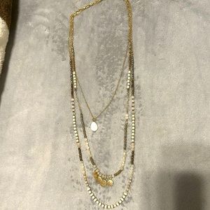 Multi layer long necklace.